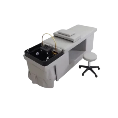 Umira Head Spa with grey treatment table and black plumbed basin